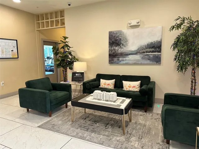 a living room with lots of furniture and a gym equipment