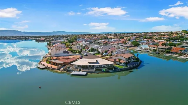 an aerial view of a house with a ocean view