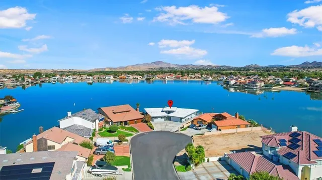 an aerial view of a house with swimming pool garden and patio