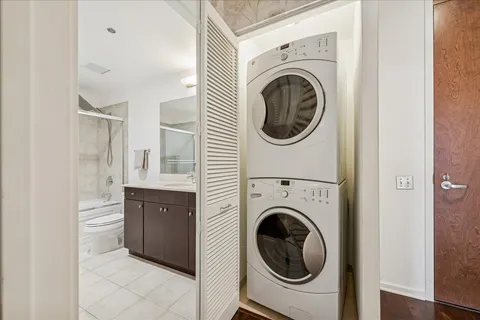 a view of a hallway with washer and dryer
