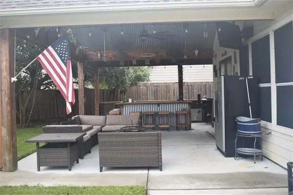 a outdoor living space with patio furniture and potted plants