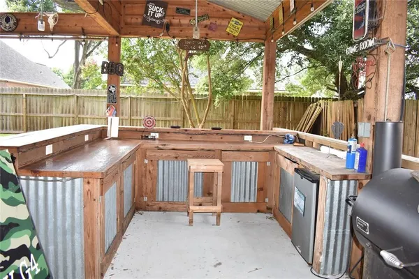 a view of a patio with a table and chairs