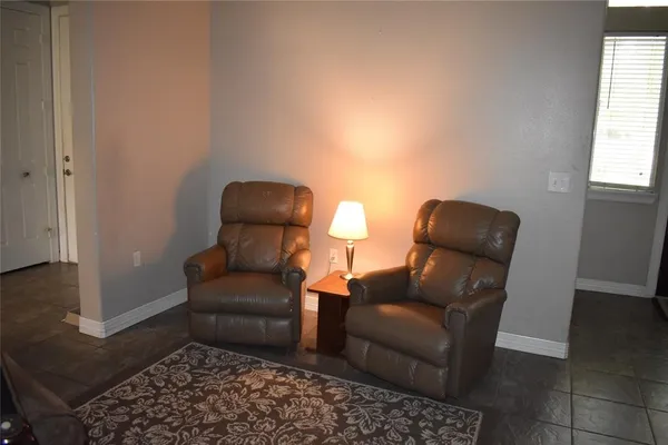 a living room with furniture and a window