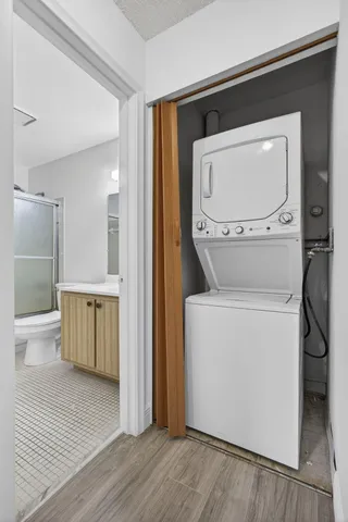 a bathroom with a shower toilet and sink