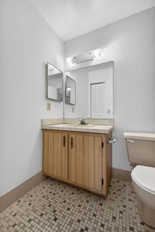 an aerial view of a house with a garden and lake view