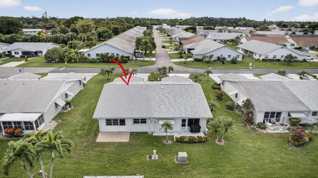 an aerial view of a houses with outdoor space