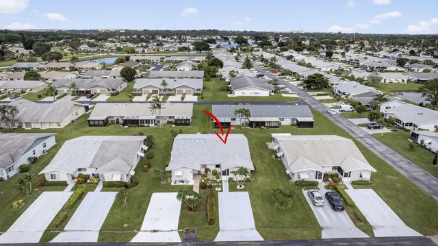 a living room with furniture and flowers