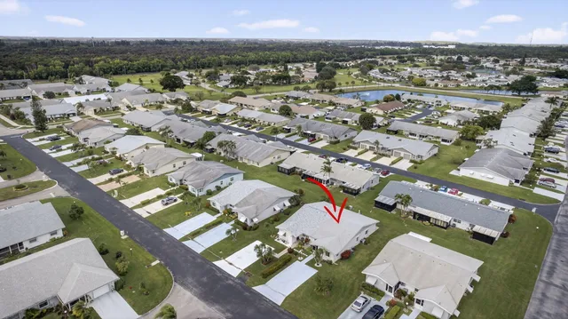 a view of a work space with furniture and wooden floor