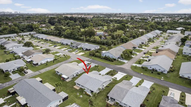 a view of a chairs and table in patio with a lake view