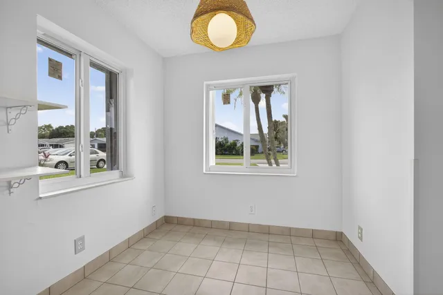 a kitchen with stainless steel appliances granite countertop a refrigerator a stove and a sink