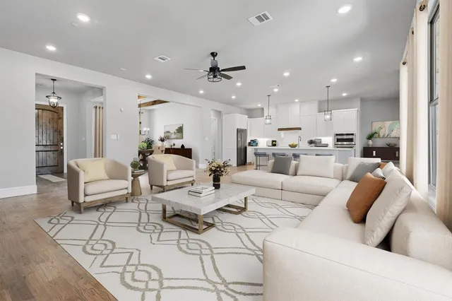 a spacious bedroom with a bed and glass windows