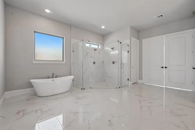 a bathroom with a sink a toilet and bathtub