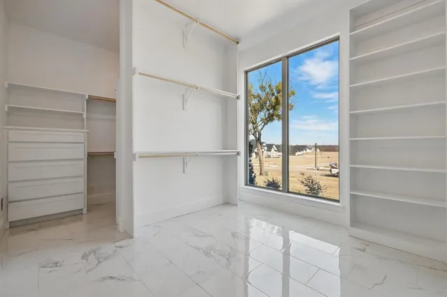 a bedroom with a bed and a cabinets