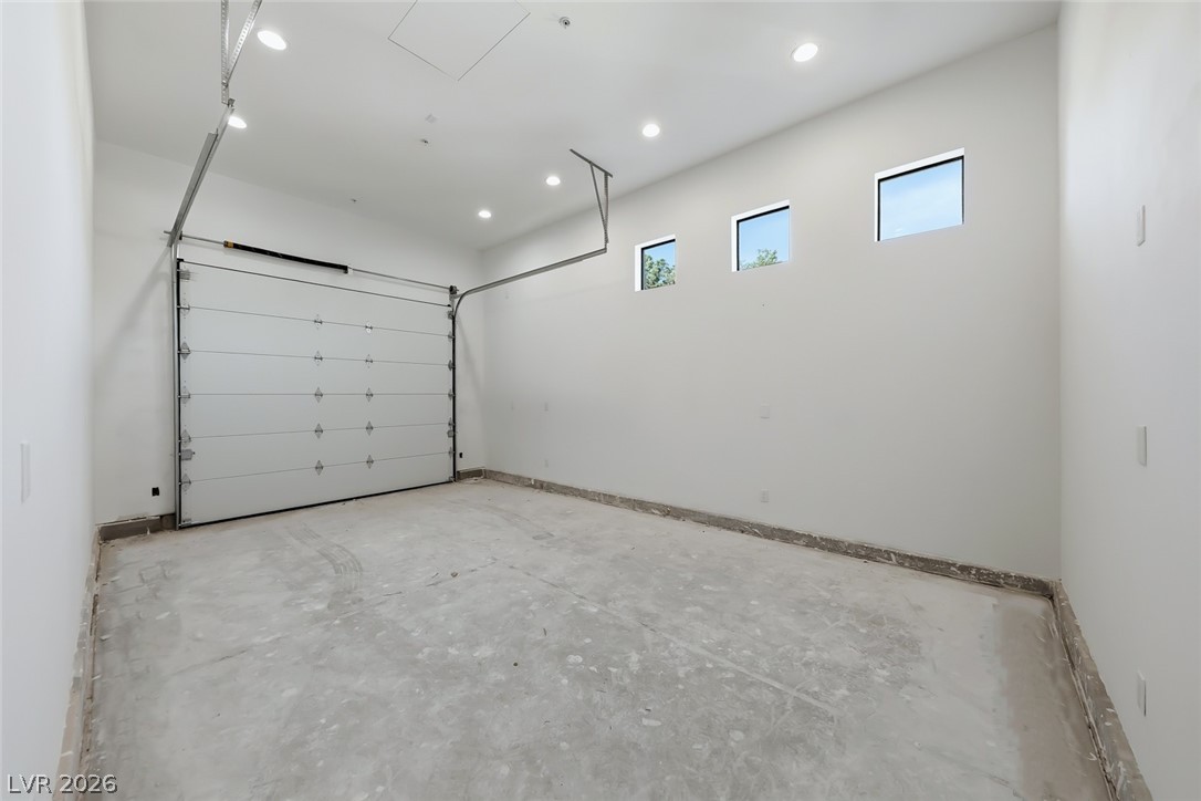 1140 Julie Road Henderson, NV 89002 - Photo 61 of 71 1140 JULIE RD HENDERSON NV 89002 Ample space for vehicles and storage with a durable concrete floor.
