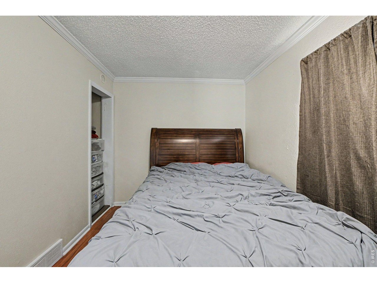 427 9th Street Greeley, CO 80631 - Photo 15 of 22 a bedroom with a bed and a cabinets