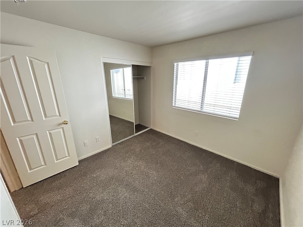 1840 Montvale Las Vegas, NV 89134 - Photo 19 of 31 Well-maintained carpeting extends through this comfortably proportioned bedroom, offering a serene retreat.