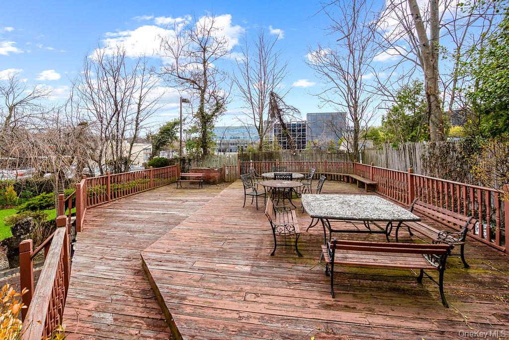11 Valley View Road Great Neck, NY 11021 - Photo 12 of 19 a wooden bench sitting on top of a wooden floor