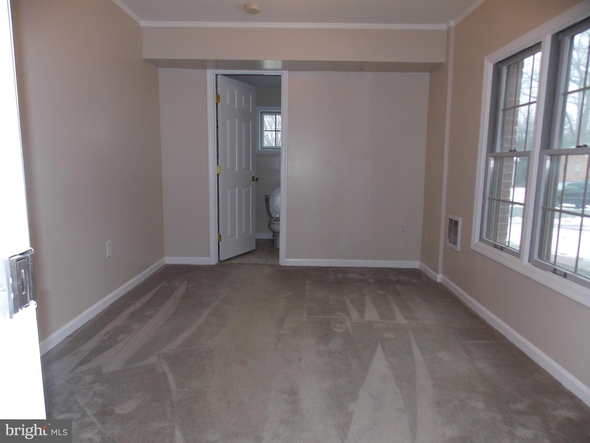 7125 Catlett Street Springfield, VA 22151 - Photo 18 of 26 a view of an empty room with a window