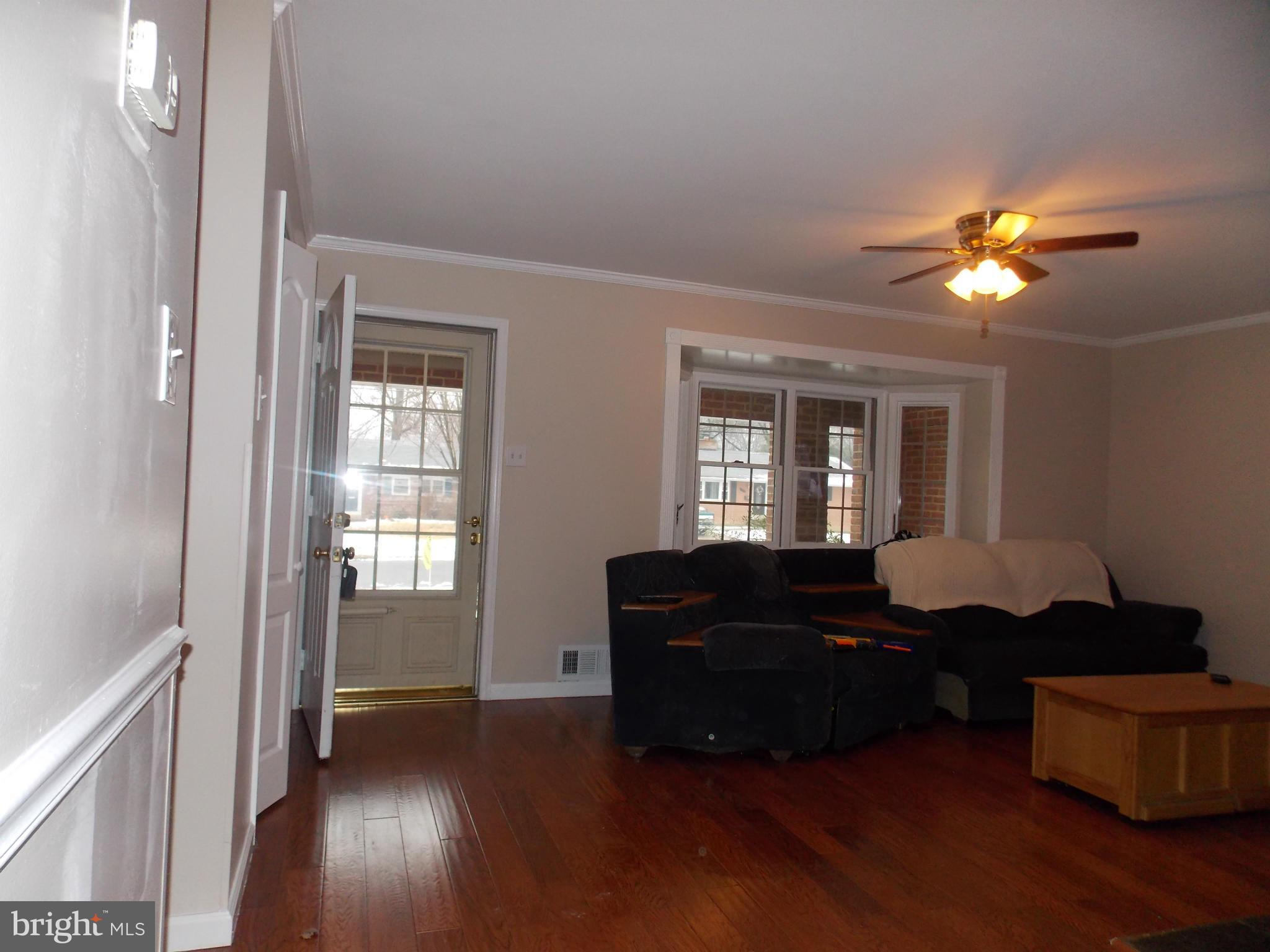 7125 Catlett Street Springfield, VA 22151 - Photo 7 of 26 a living room with furniture and a window