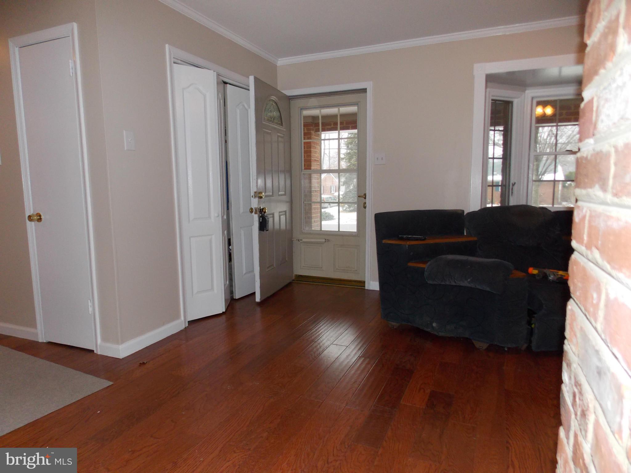 7125 Catlett Street Springfield, VA 22151 - Photo 8 of 26 a living room with furniture and wooden floor