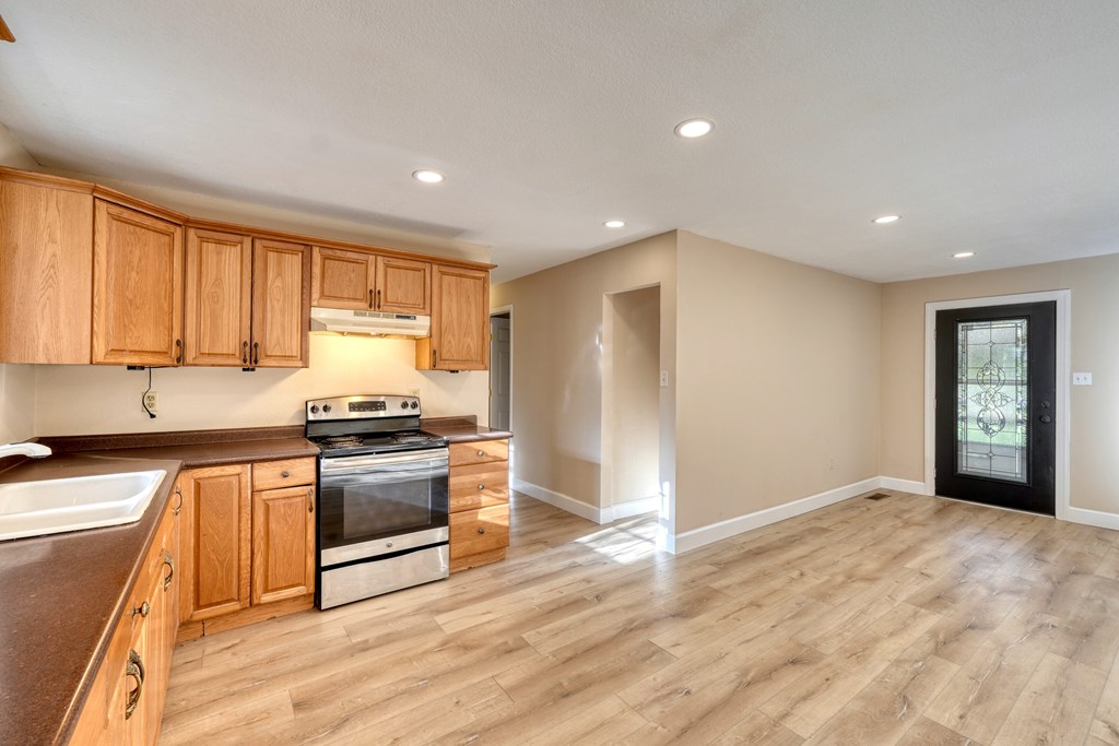 110 Johnson Road Hayesville, NC 28904 - Photo 15 of 41 a kitchen with stainless steel appliances granite countertop a stove a sink and a refrigerator