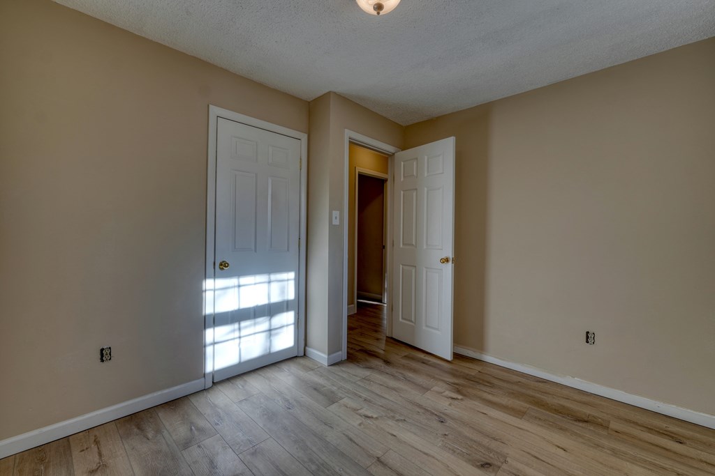 110 Johnson Road Hayesville, NC 28904 - Photo 23 of 41 an empty room with wooden floor and windows