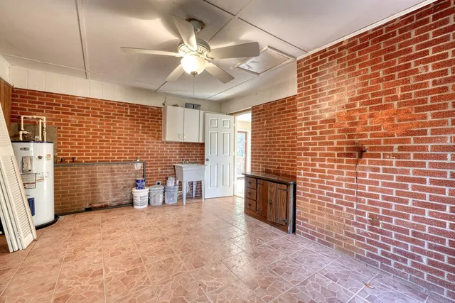 a view of empty room with a fireplace