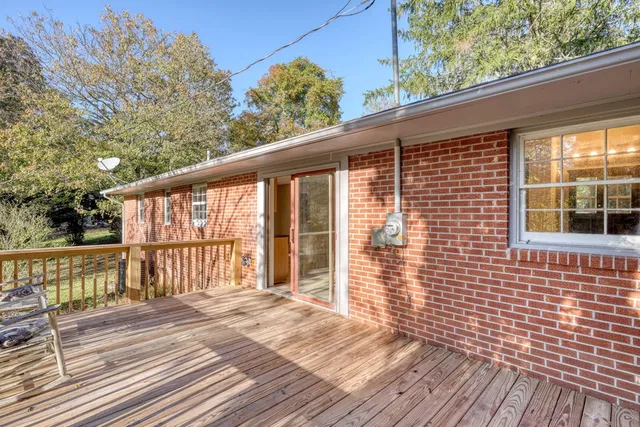 a view of a balcony with wooden floor