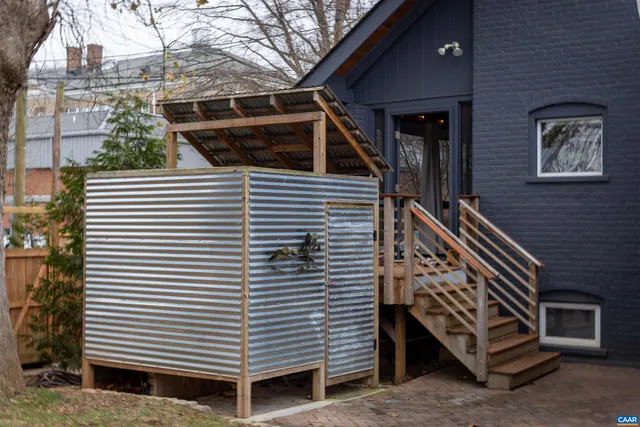 a view of a house with a door and a yard