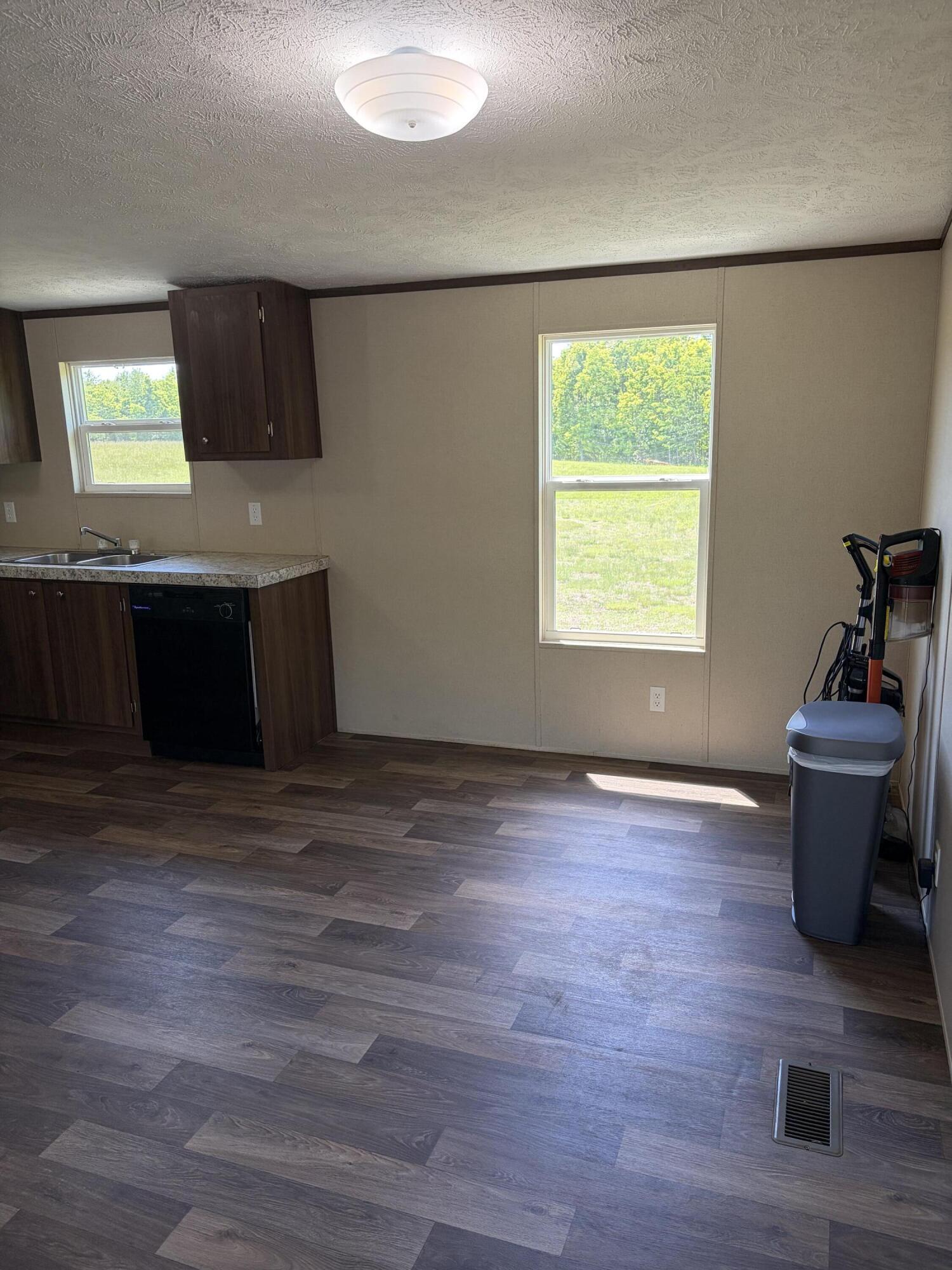 1644 Gap Road Chatham, VA 24531 - Photo 4 of 15 a view of an empty room with a window and wooden floor