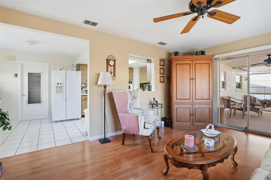 7329 Cay Drive Port Richey, FL 34668 - Photo 20 of 38 a living room with furniture and a wooden floor