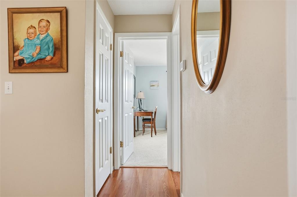 7329 Cay Drive Port Richey, FL 34668 - Photo 22 of 38 a view of a hallway with wooden floor and windows