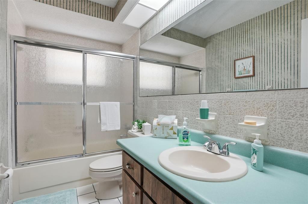 7329 Cay Drive Port Richey, FL 34668 - Photo 25 of 38 a bathroom with a sink toilet and shower