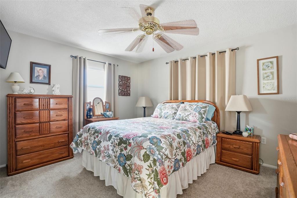 7329 Cay Drive Port Richey, FL 34668 - Photo 26 of 38 a bedroom with a bed and a closet