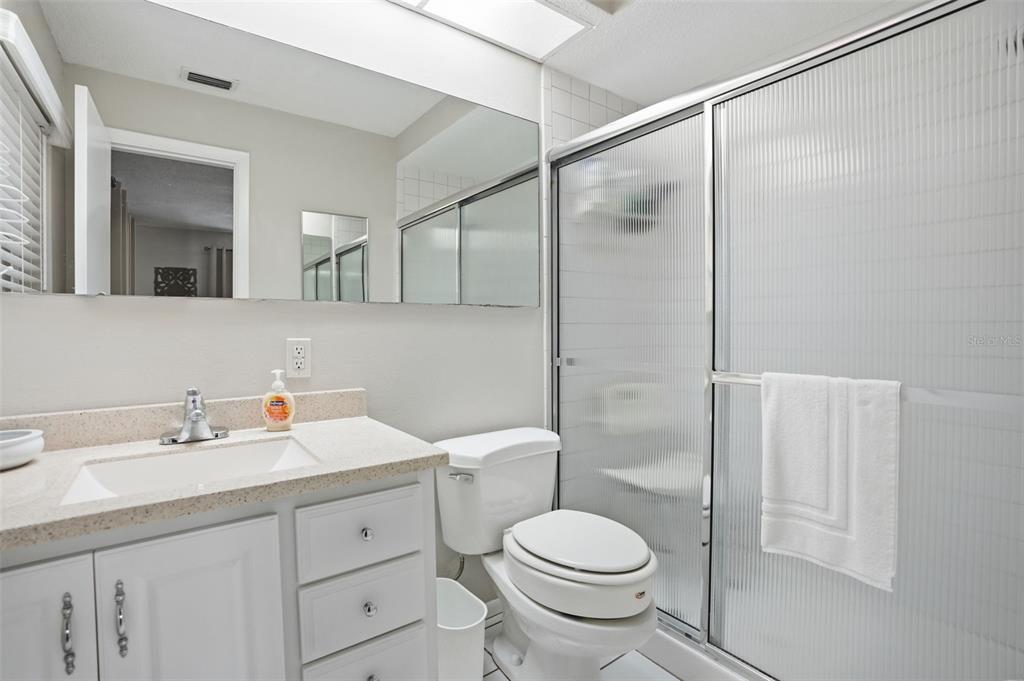 7329 Cay Drive Port Richey, FL 34668 - Photo 28 of 38 a bathroom with a sink a toilet and shower