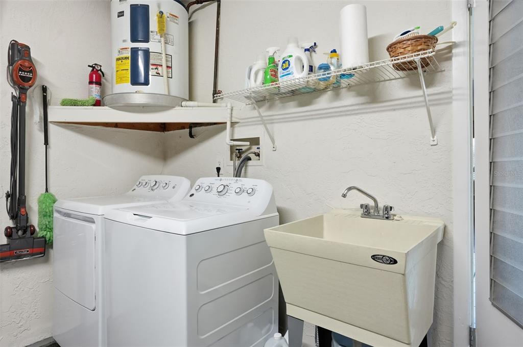 7329 Cay Drive Port Richey, FL 34668 - Photo 29 of 38 a bathroom with a sink and a mirror
