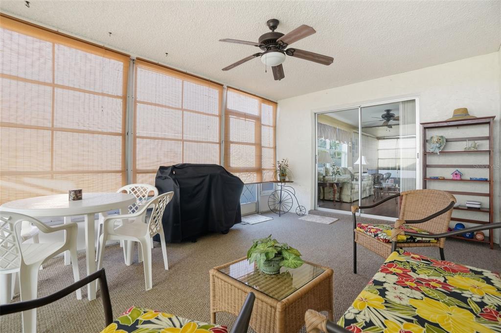 7329 Cay Drive Port Richey, FL 34668 - Photo 31 of 38 a living room with furniture and a floor to ceiling window