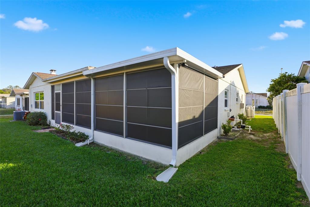 7329 Cay Drive Port Richey, FL 34668 - Photo 36 of 38 a view of an house with backyard space and garden