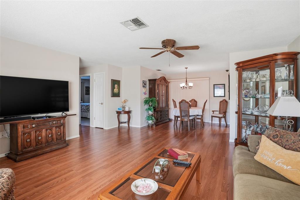 7329 Cay Drive Port Richey, FL 34668 - Photo 8 of 38 a living room with furniture and a flat screen tv