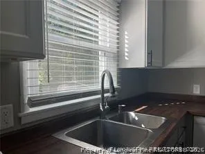 a kitchen with a sink and a window