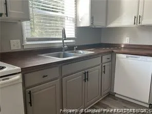 a kitchen with a sink and cabinets