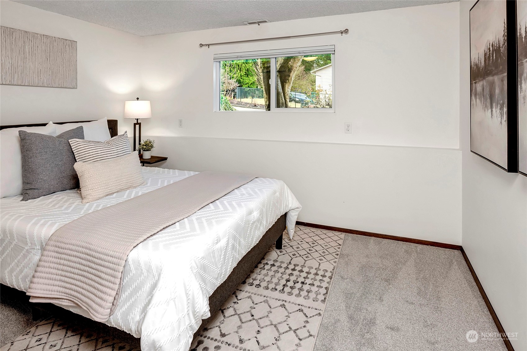 3405 197th Place Southeast Bothell, WA 98012 - Photo 12 of 17 a bedroom with a bed and a window