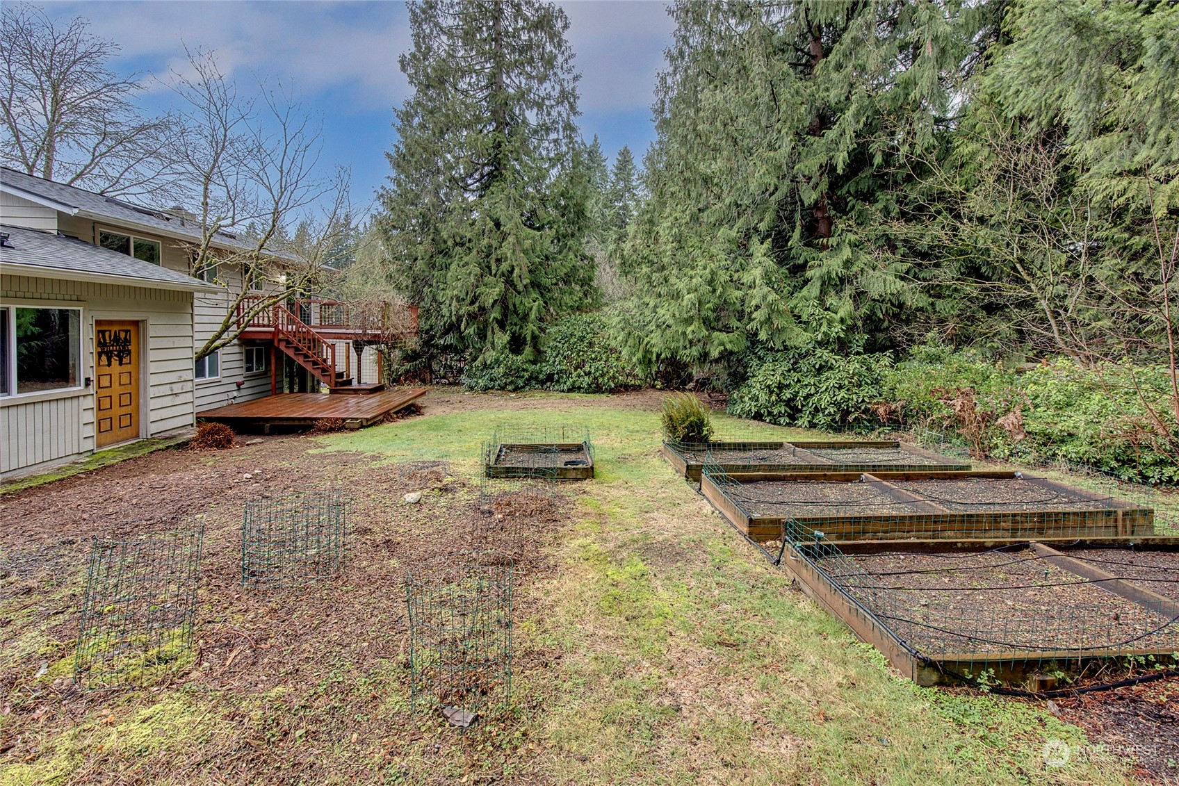 3405 197th Place Southeast Bothell, WA 98012 - Photo 17 of 17 a view of a backyard with plants and a patio