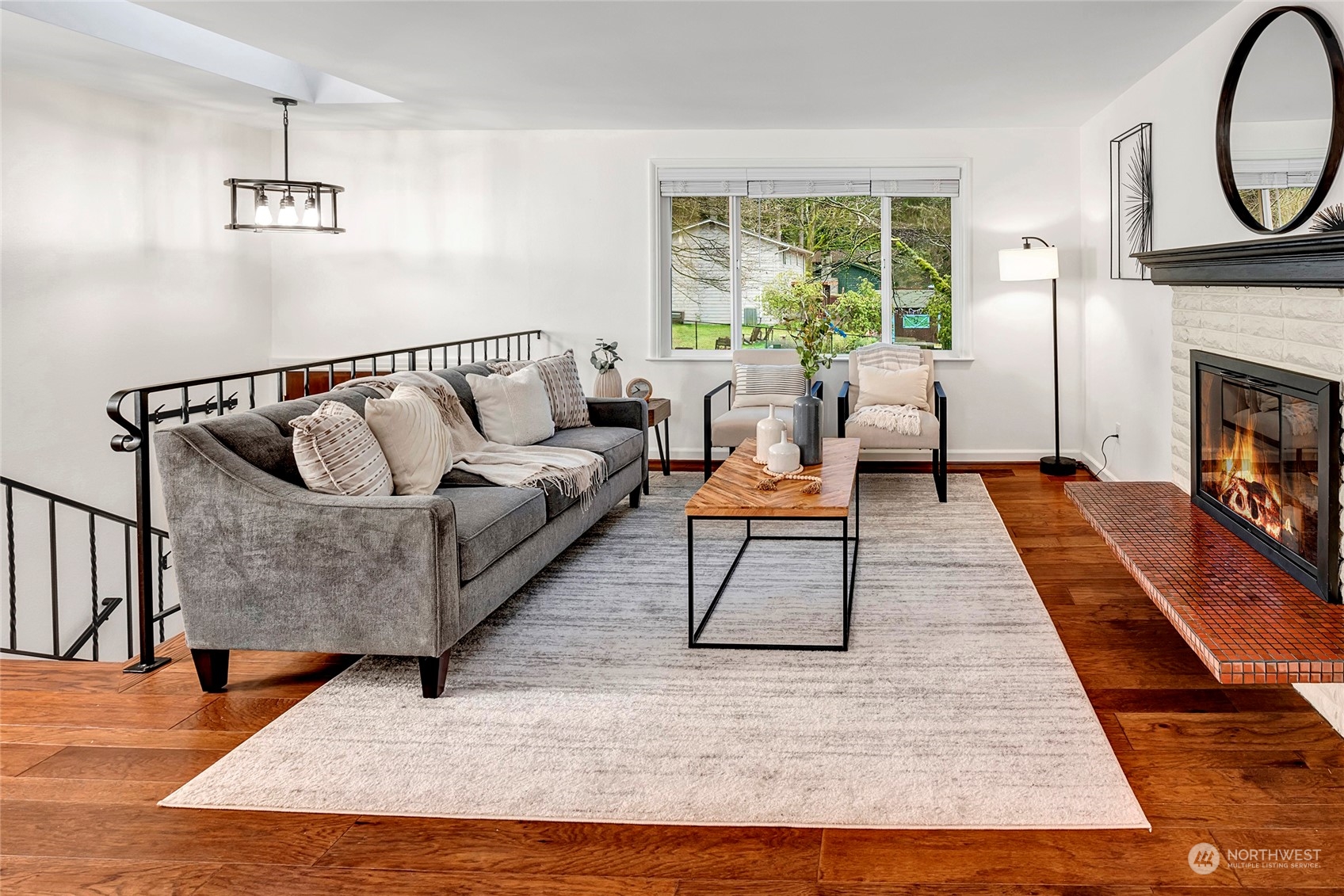 3405 197th Place Southeast Bothell, WA 98012 - Photo 6 of 17 a living room with furniture and a fireplace
