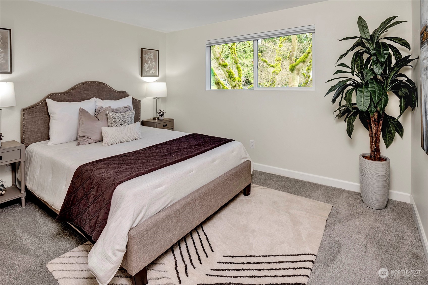 3405 197th Place Southeast Bothell, WA 98012 - Photo 10 of 17 a bedroom with a bed and a potted plant