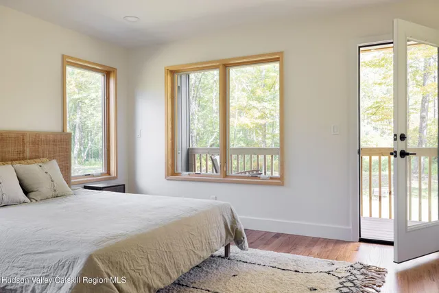 a view of balcony with wooden floor and outdoor seating