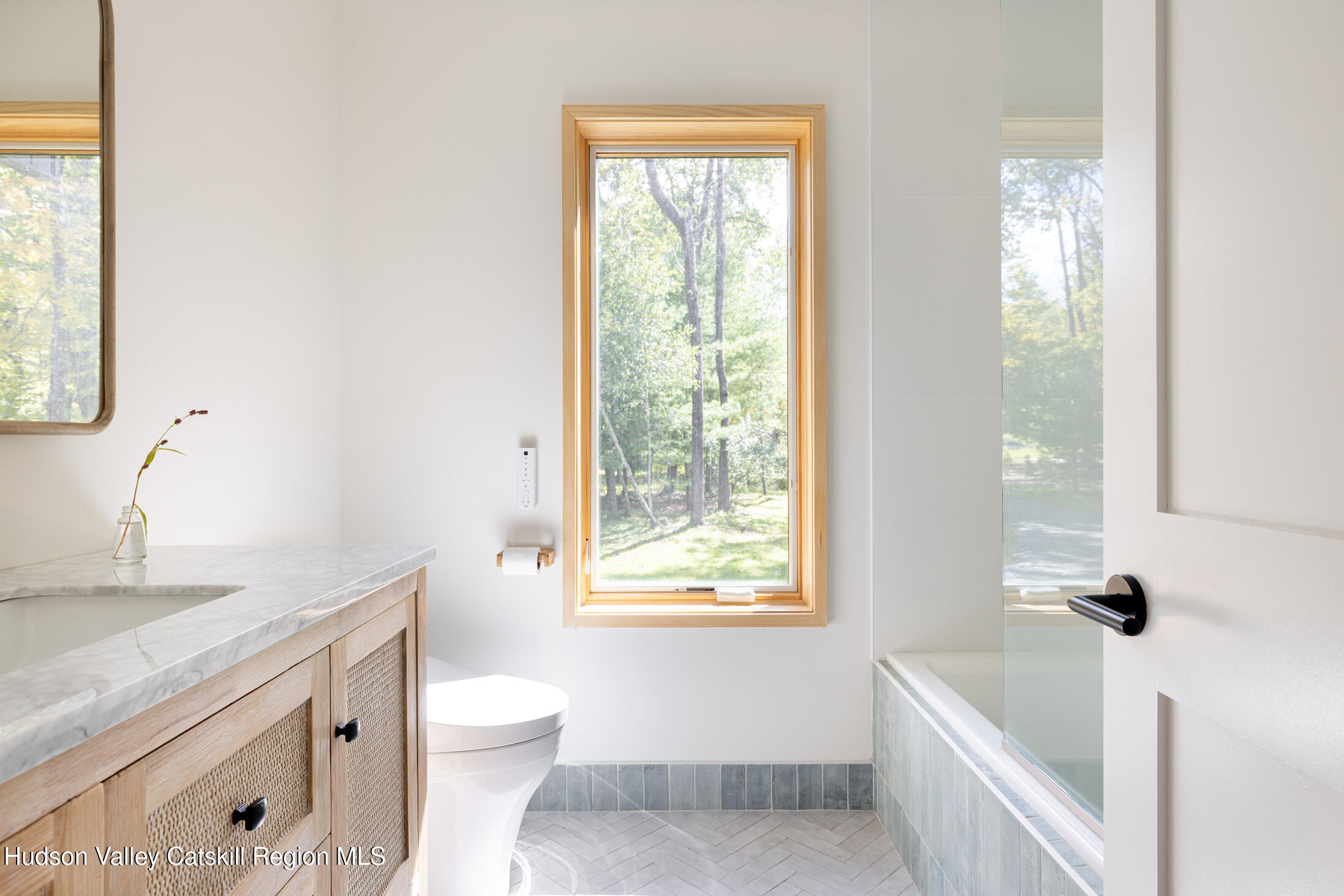 171 Birchall Road Wawarsing, NY 12428 - Photo 20 of 26 a bathroom with a granite countertop sink a toilet and a bathtub