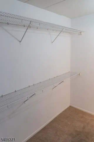 a view of room with hardwood floor and window