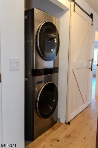 a living room with furniture and a mirror