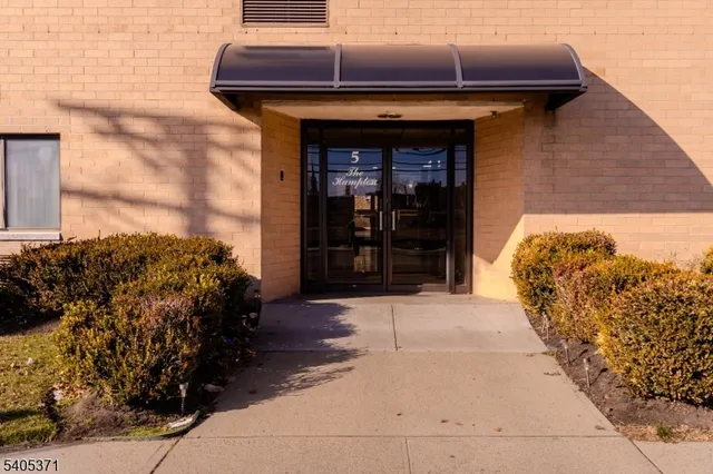 a front view of a house with a garage